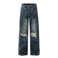 Old dirty dyed and ripped jeans