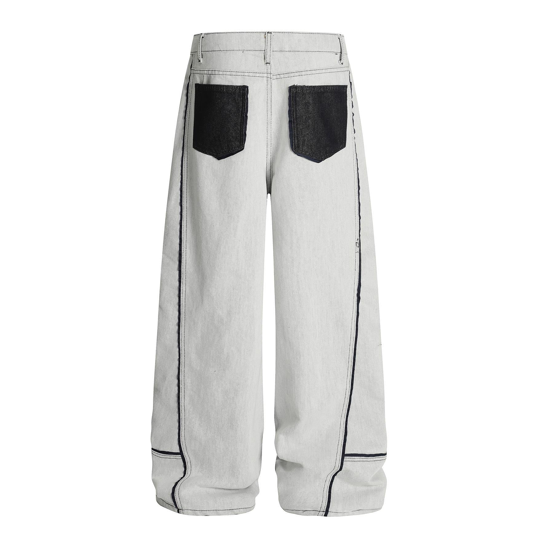 Washed distressed deconstruction with visible stitching and drawstring jeans