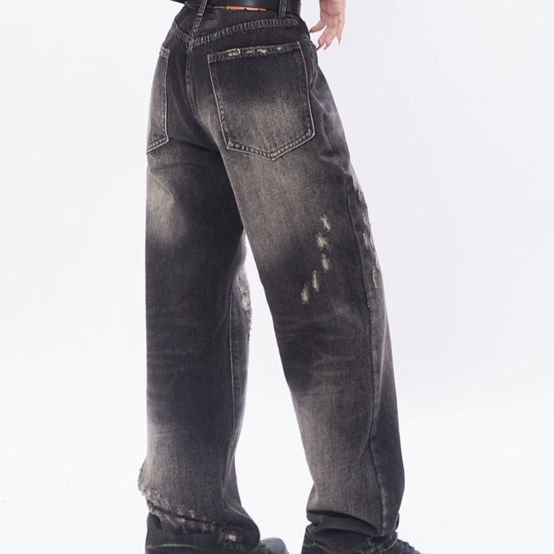 Loose distressed scratched straight leg jeans
