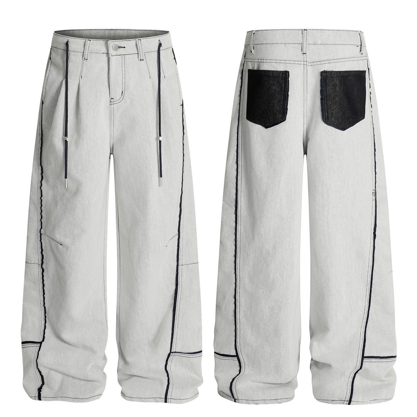 Washed distressed deconstruction with visible stitching and drawstring jeans