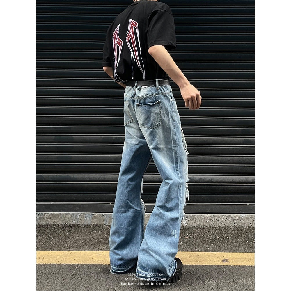 Vintage washed distressed micro flared jeans with holes
