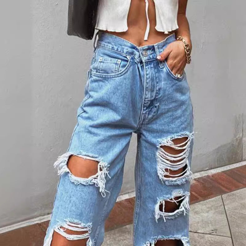Thin jeans with wide legs and holes for women