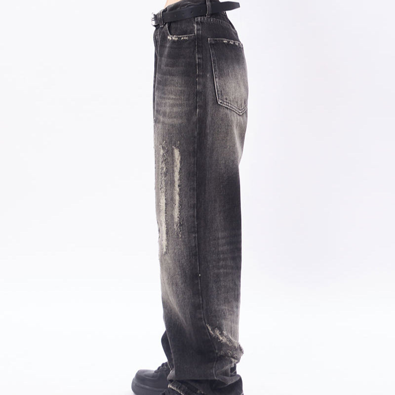 Loose distressed scratched straight leg jeans