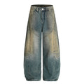 Washed denim jeans with an old silhouette and curved edges