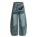 Embroidered wide leg curved knife jeans