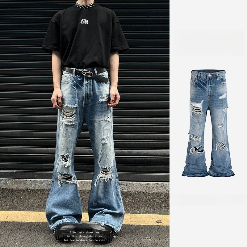 Vintage washed distressed micro flared jeans with holes